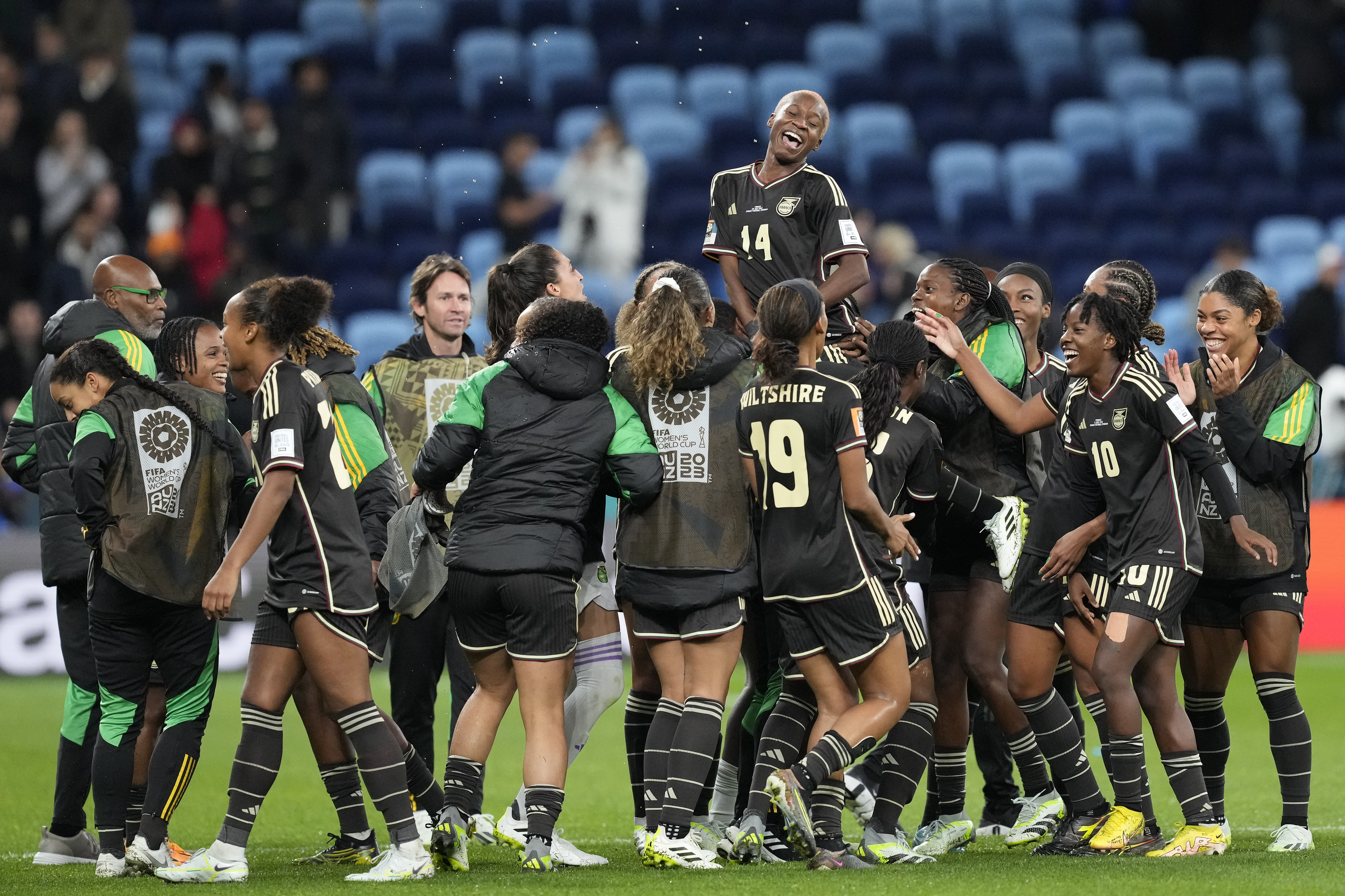 Jamaica's Deneisha Blackwood, top, celebrates with her teammates after the Women's World Cup Group F soccer match between France and Jamaica at the Sydney Football Stadium in Sydney, Australia, Sunday, July 23, 2023. The match ended in a 0-0 draw. 