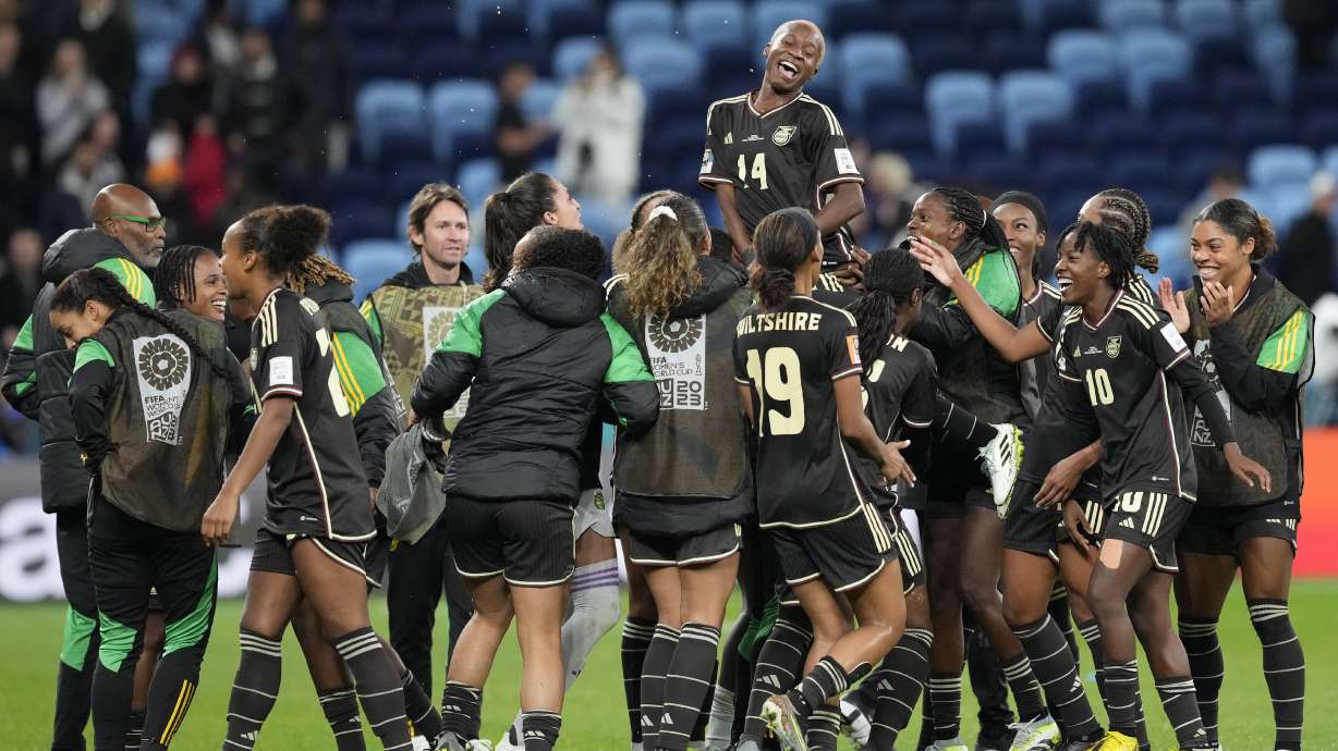 Jamaica's Deneisha Blackwood, top, celebrates with her teammates after the Women's World Cup Group F soccer match between France and Jamaica at the Sydney Football Stadium in Sydney, Australia, Sunday, July 23, 2023. The match ended in a 0-0 draw.