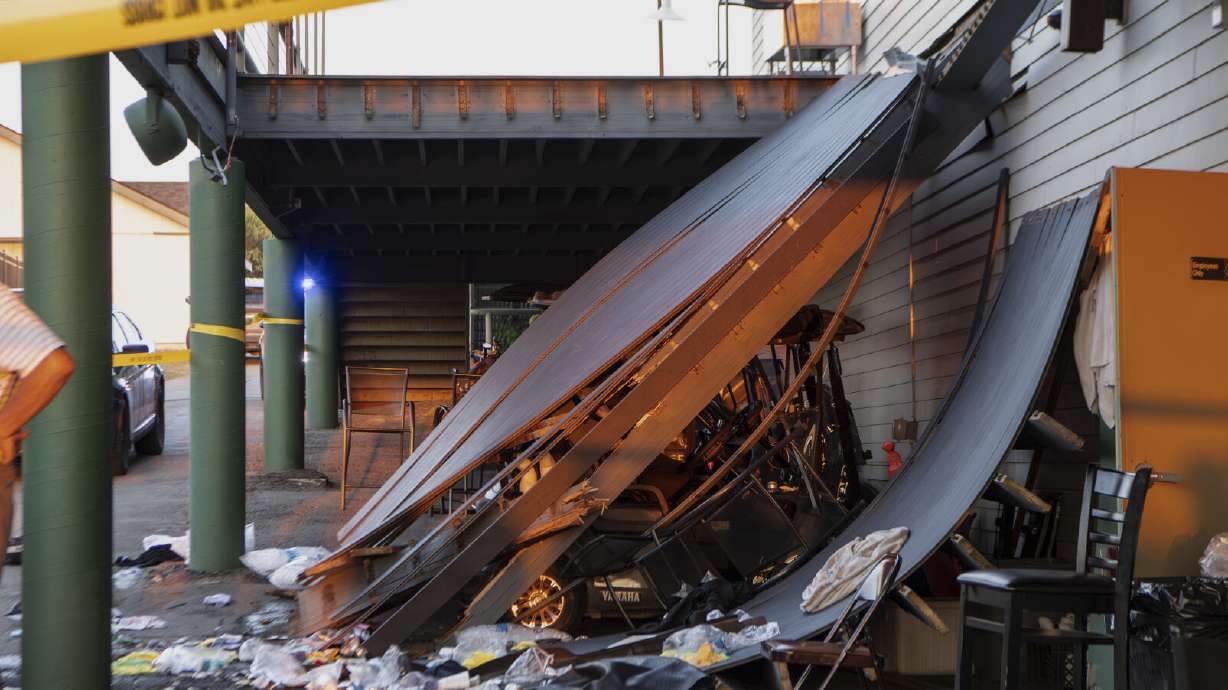 Police tape is wrapped around the scene of a deck collapse at Briarwood Country Club in Billings, Mont., Sunday. The deck collapsed, leaving more than 30 injured on Saturday evening.