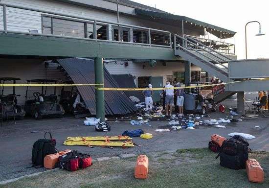 First responders work the scene of a deck collapse at Briarwood Country Club in Billings, Mont., Sunday. The deck collapsed, leaving up to 25 people injured on Saturday evening, police and news reports said.