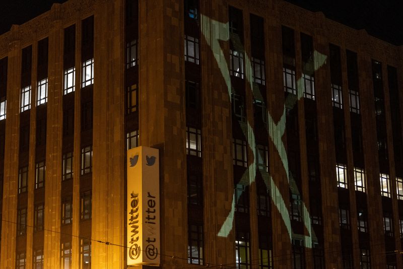 Twitter's new logo is seen projected on the corporate headquarters building in downtown San Francisco on Sunday. 