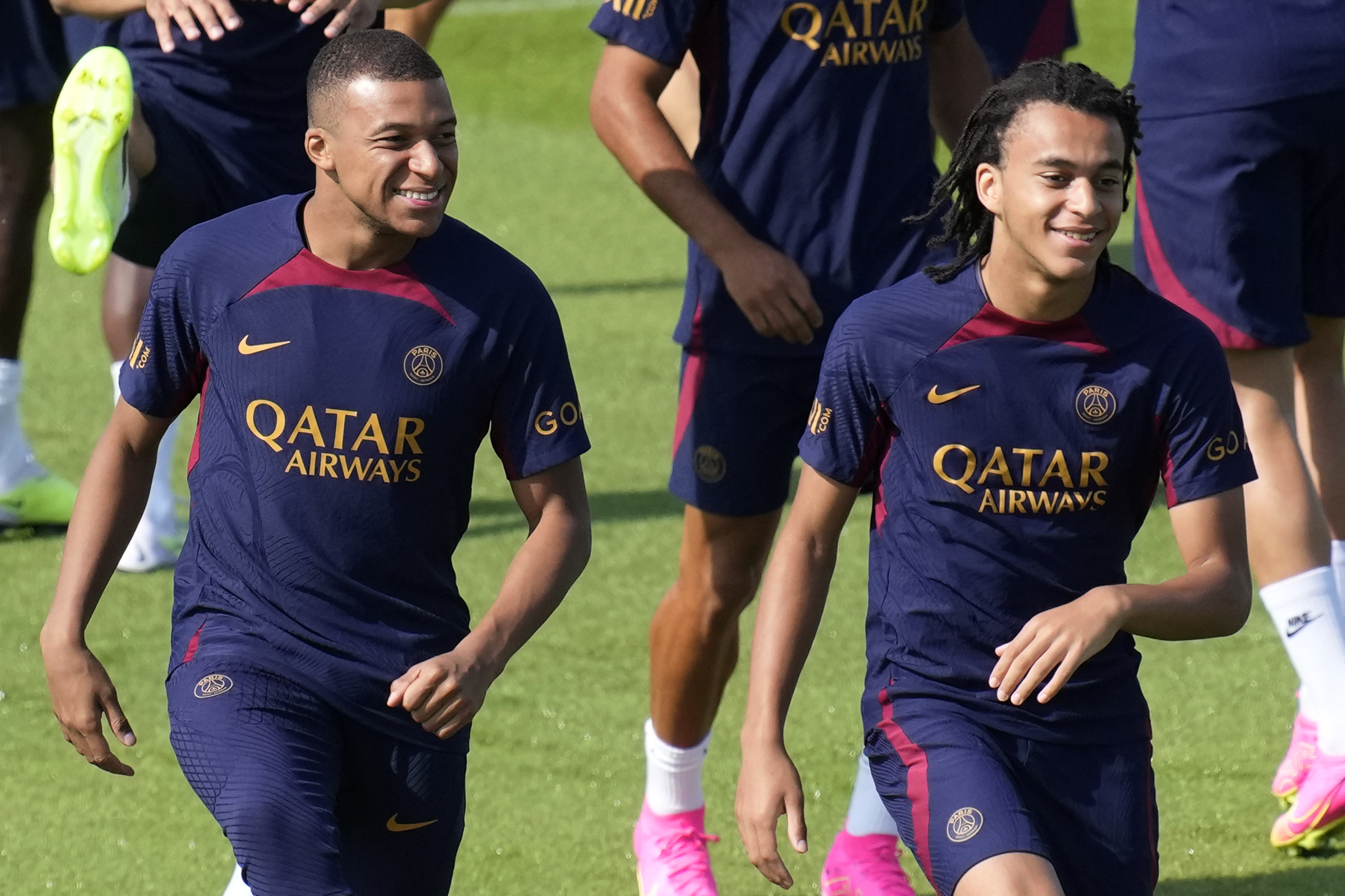 Kylian Mbappe, left, and his brother Ethan Mbappe attend a training session at the new Paris Saint-Germain training center Thursday, July 20, 2023 in Poissy, west of Paris. 