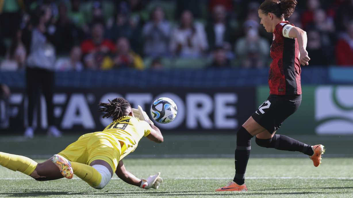 Nigeria's goalkeeper Chiamaka Nnadozie saves a penalty kick by Canada's Christine Sinclair, right, during the Women's World Cup Group B soccer match between Nigeria and Canada in Melbourne, Australia, Friday, July 21, 2023.