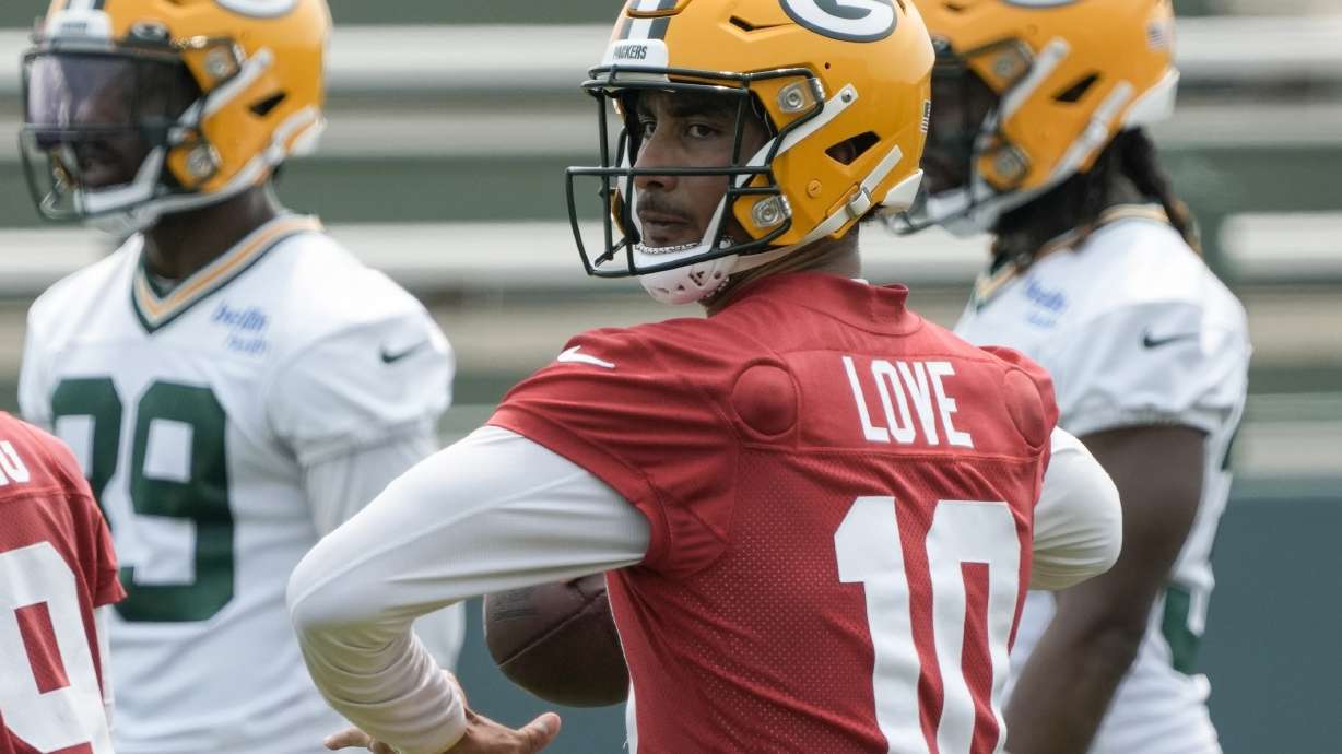Green Bay Packers' Jordan Love drops back to pass during an NFL football mini camp practice session Wednesday, June 14, 2023, in Green Bay, Wis. The former Utah State standout is expected to guide the Packers as starting quarterback with Aaron Rodgers off to New York.