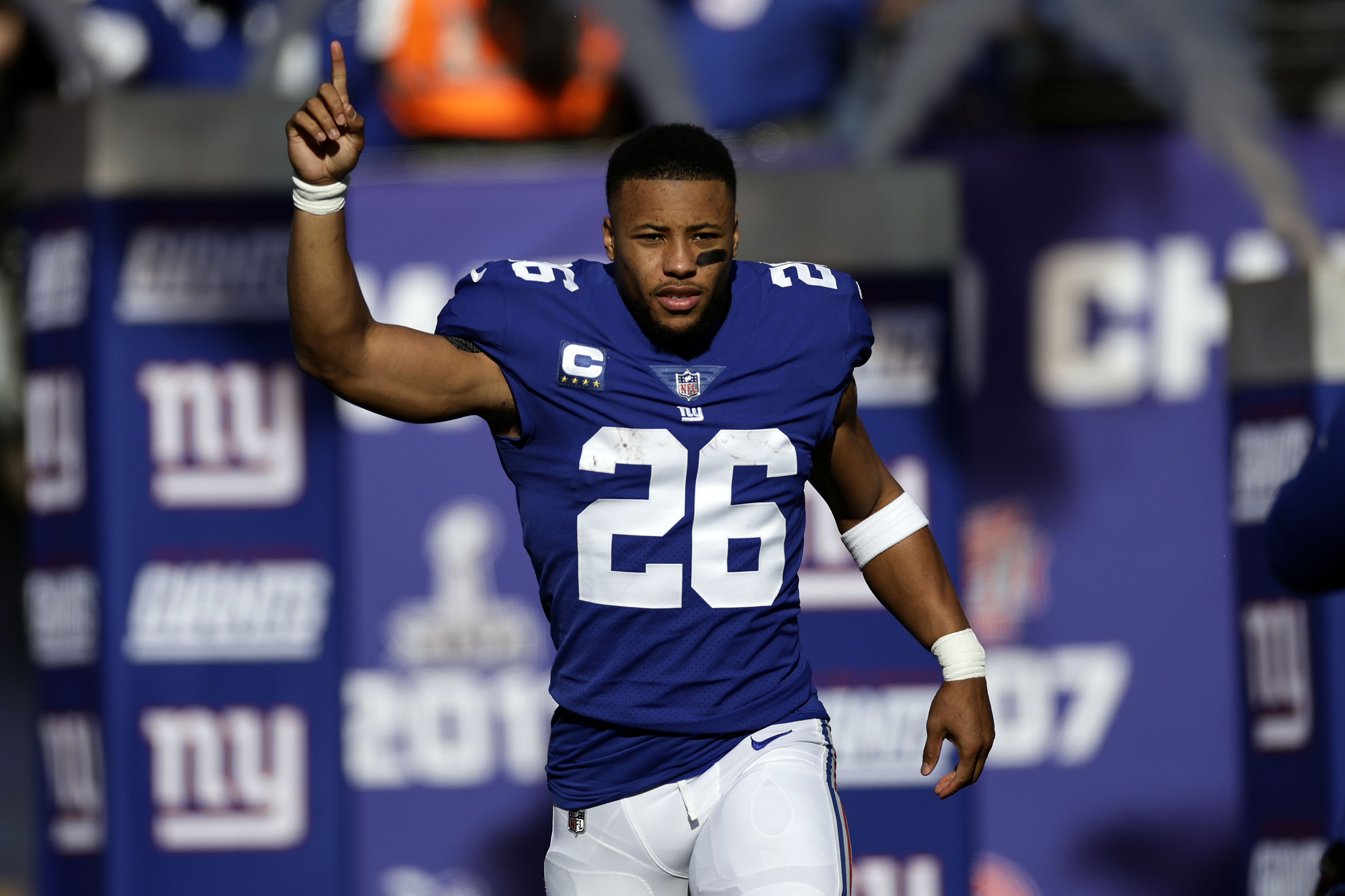 FILE - New York Giants running back Saquon Barkley is introduced before an NFL football game against the Indianapolis Colts, Jan. 1, 2023, in East Rutherford, N.J. Barkley and the Giants failed to reach an agreement on a long-term contract extension by the Monday, July 17, 2023, deadline for franchised players, leaving the star running back with the option of playing for the tag-mandated $10.1 million salary or maybe taking the season off.