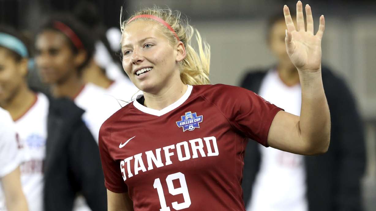 FILE - Stanford goalkeeper Katie Meyer (19) acknowledges the crowd after the team's 4-1 win over UCLA in a semifinal of the NCAA Division I women's soccer tournament in San Jose, Calif., on Dec. 6, 2019.