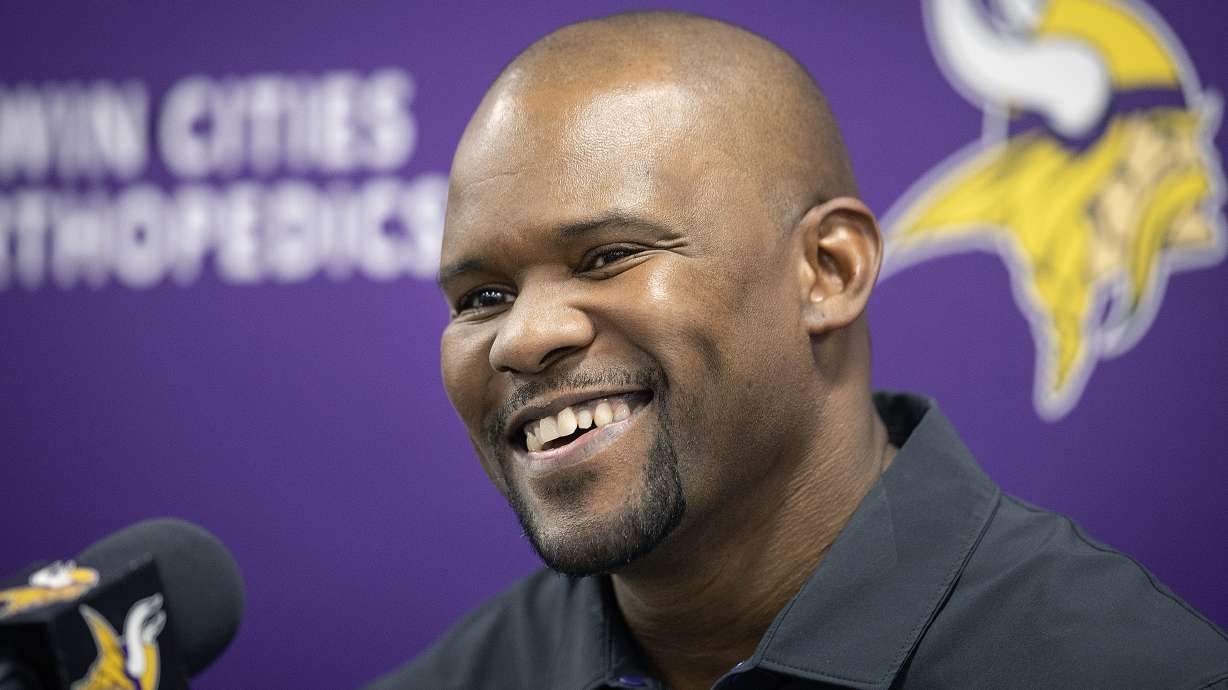 FILE - Minnesota Vikings new defensive coordinator Brian Flores is introduced during an NFL football news conference, Wednesday, Feb. 15, 2023, in Eagan, Minn. A federal judge said Tuesday, July 25, that she’s not changing her decision to let NFL coach Brian Flores put the league and three of its teams on trial over his claims that he and other Black coaches face discrimination./Star Tribune via AP, File)