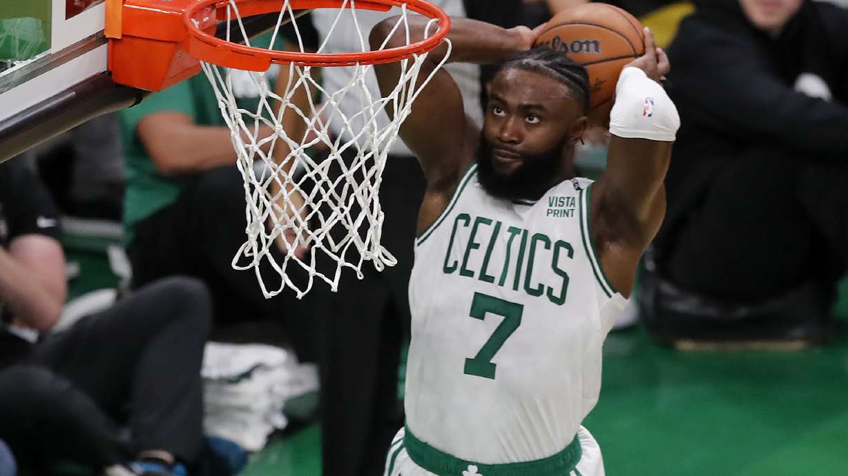 FILE - Boston Celtics' Jaylen Brown (7) dunks the ball against the Golden State Warriors during the second quarter of Game 3 of basketball's NBA Finals, Wednesday, June 8, 2022, in Boston. Celtics wing Jaylen Brown has agreed to terms on a five-year supermax contract extension that will pay him up to $304 million, his agent said on Tuesday, July 25, 2023.