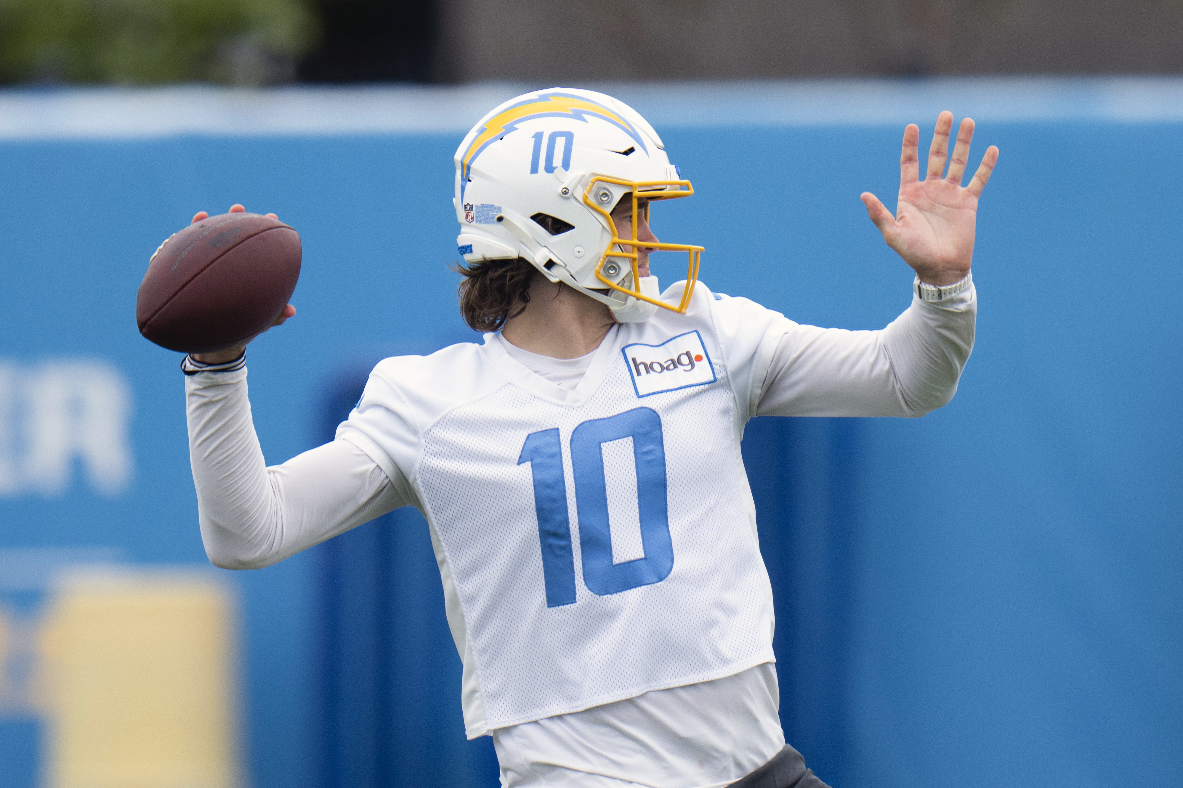 FILE - Los Angeles Chargers quarterback Justin Herbert (10) runs a drill during the NFL football team's camp Monday, May 22, 2023, in Costa Mesa, Calif.