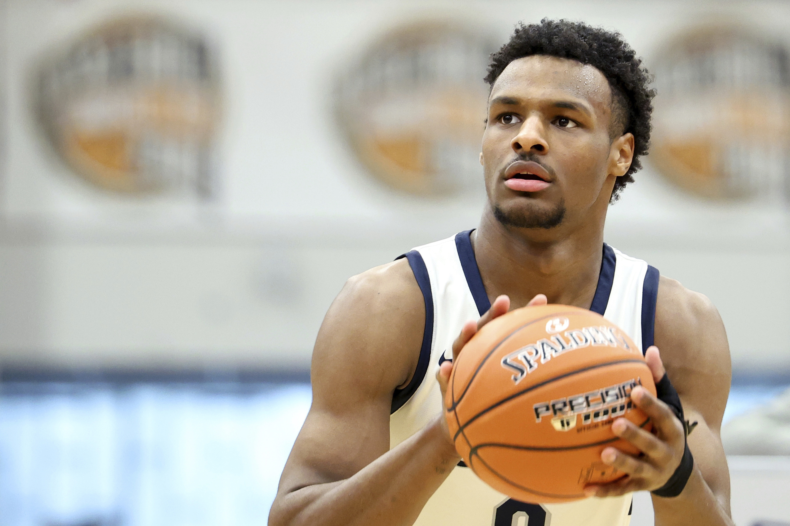 FILE - Sierra Canyon's Bronny James warms up at halftime during a high school basketball game against Christopher Columbus at the Hoophall Classic, Monday, January 16, 2023, in Springfield, Mass. Bronny James, son of NBA superstar LeBron James, was hospitalized after going into cardiac arrest while participating in a practice at Southern California on Monday, July 24, 2023.