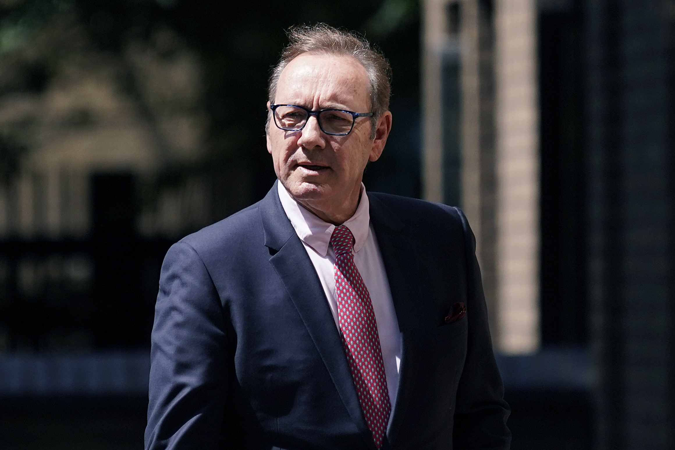 Actor Kevin Spacey walks outside Southwark Crown Court in London, Wednesday. The jury found Spacey not guilty of nine charges including sexual assault, alleged between 2001 and 2013. 