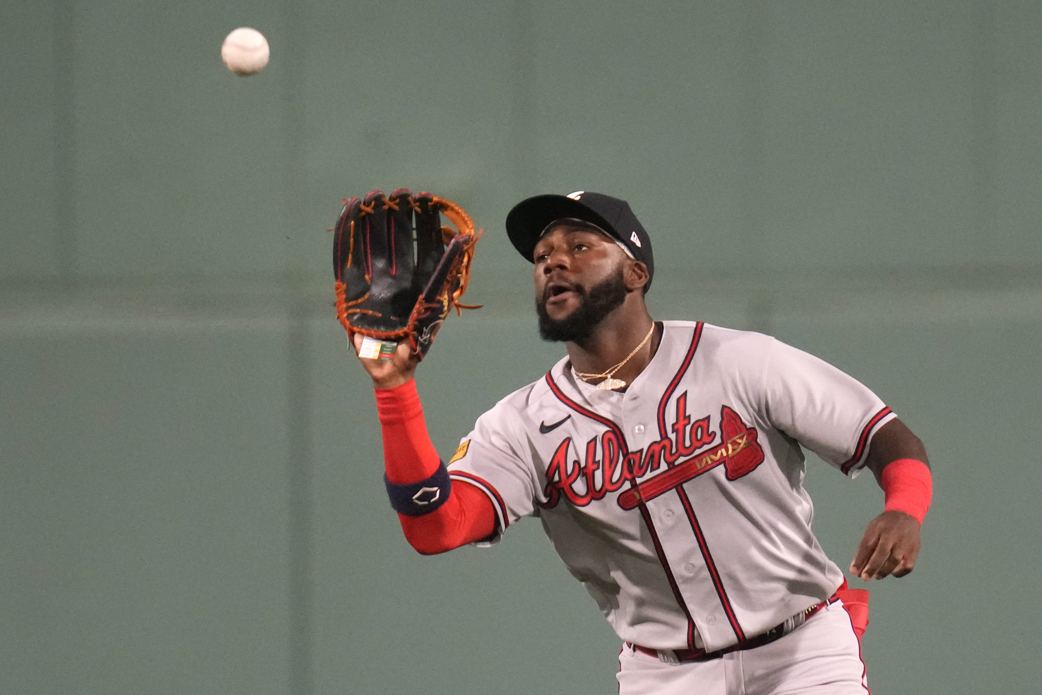 Atlanta Braves center fielder Michael Harris II makes the play on a fly out by Boston Red Sox first baseman Triston Casas, which was the first out of a triple play, during the third inning of a baseball game at Fenway Park, Tuesday, July 25, 2023, in Boston.