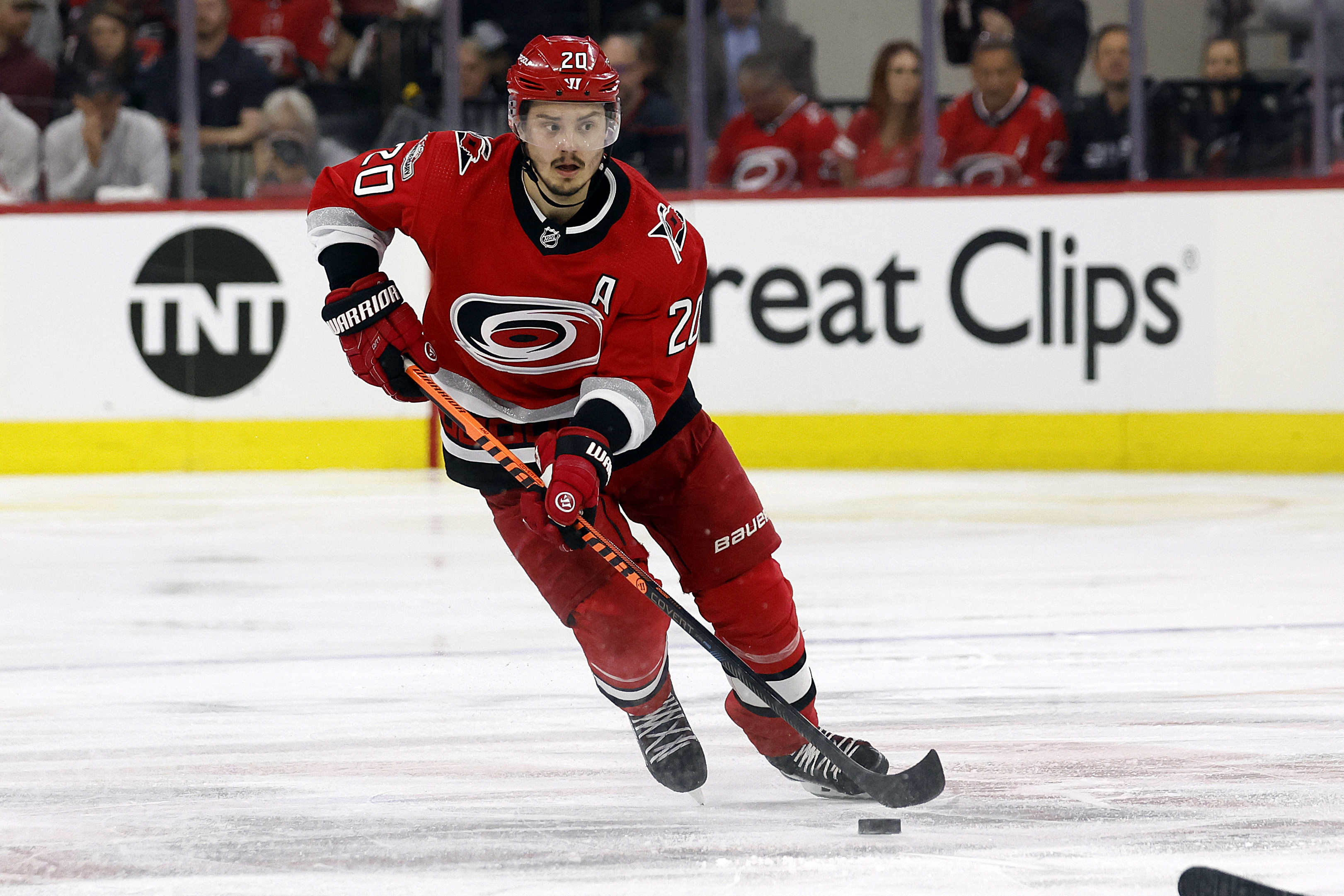 FILE - Carolina Hurricanes' Sebastian Aho (20) skates with the puck against the Florida Panthers during the second period of Game 2 of the NHL hockey Stanley Cup Eastern Conference finals in Raleigh, N.C., Saturday, May 20, 2023. Sebastian Aho is staying with the Carolina Hurricanes through his prime after signing an eight-year contract extension worth $78 million. The team on Wednesday, July 26, announced the deal, which goes into effect for the 2024-25 NHL season.