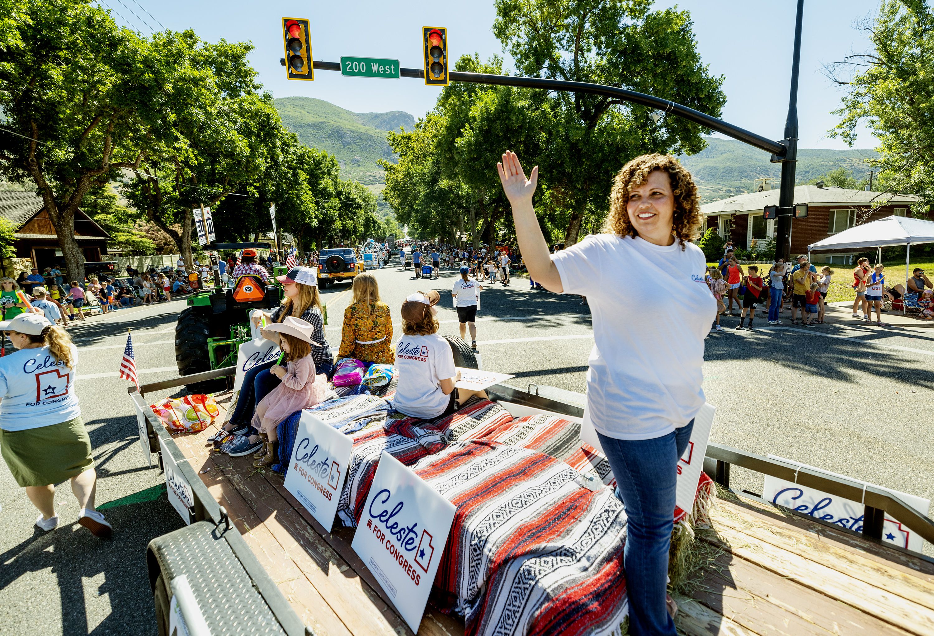 Celeste Maloy waves in a parade in Farmington on July 15. Raised in a single-wide trailer with her five siblings in small-town Nevada, Maloy says she wants to give voice to others like her.