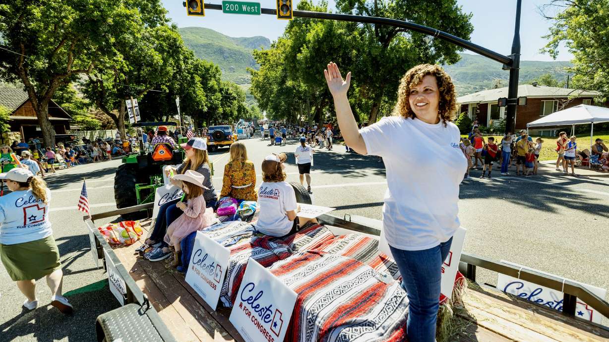 Celeste Maloy waves in a parade in Farmington on July 15. Raised in a single-wide trailer with her five siblings in small-town Nevada, Maloy says she wants to give voice to others like her.