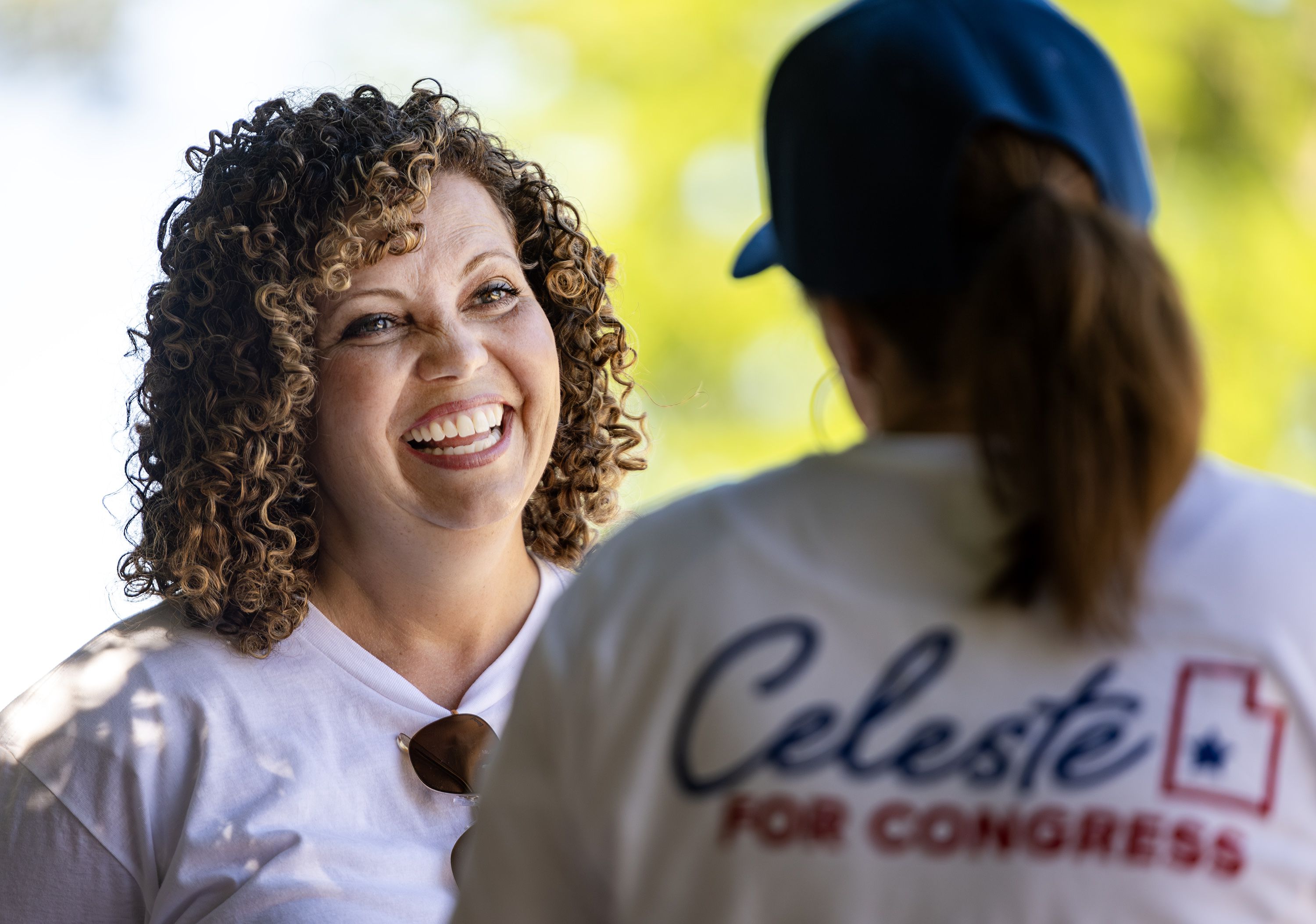 Celeste Maloy, congressional candidate, smiles at her campaign manager, Rhonda Perkes, as they talk prior to participating in a parade in Farmington on July 15.