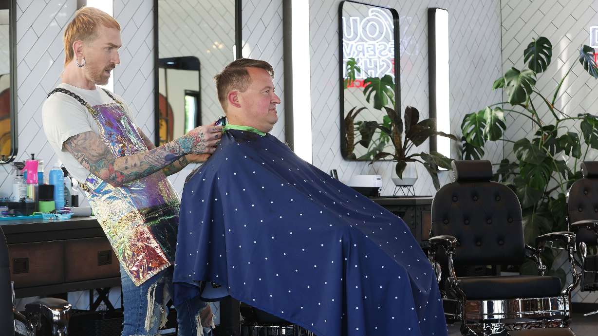 Salt Lake Barber Company barber Drew Landerman gives Jeremy Grimshaw a haircut in Salt Lake City on Tuesday. A new analysis by Pew Research finds 1 in 5 U.S. workers have the highest exposure to being replaced by emerging artificial intelligence tools. Barbers have the least likelihood.