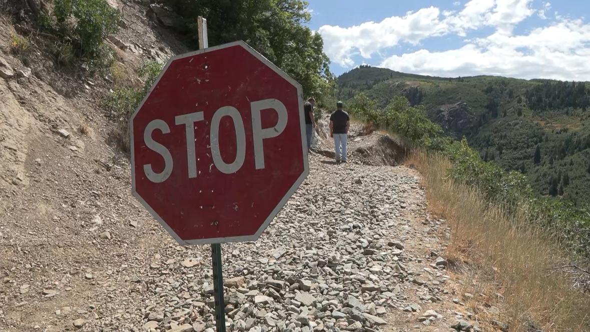 Tyson Zesiger and Luke Sowby installed a stop sign on a trail in Bountiful to warn others of dangerous conditions.