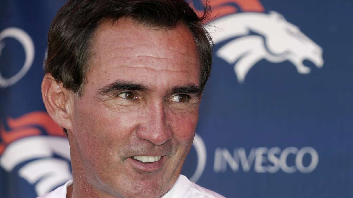 FILE - Denver Broncos head coach Mike Shanahan laughs as he talks to the media following the morning session of football training camp in Denver, Sunday, July 29, 2007. Versatile running back Roger Craig, and two-time Super Bowl-winning coaches Tom Coughlin and Mike Shanahan advanced to the next stage of consideration for the Pro Football Hall of Fame. The selection committees cut down the list of candidates from 31 seniors and 29 coaches and contributors to 12 in each category in results announced Thursday, July 27, 2023.