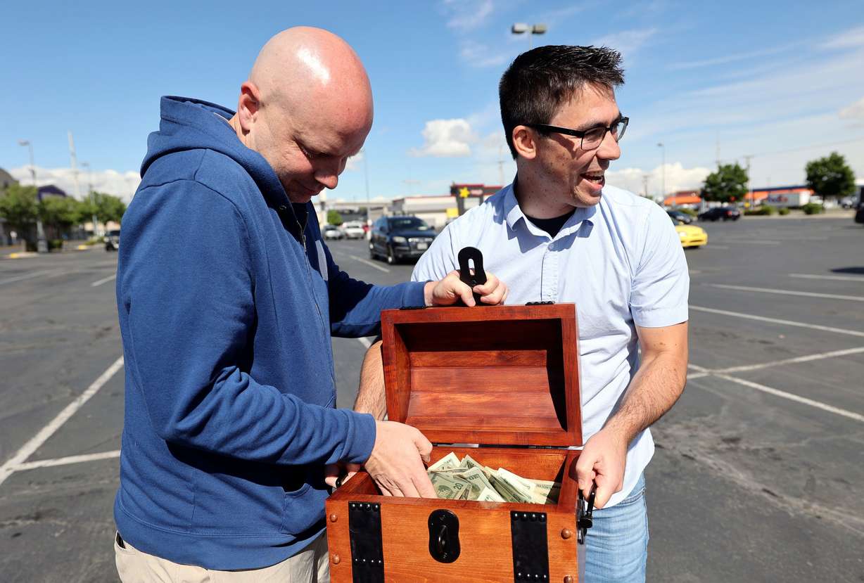 John Maxim, left, and David Cline announce plans to hide $20,000 in the Utah wilderness during a press conference in South Salt Lake on May 31, 2022. The 2023 treasure hunt was held as well, but controversy after the event has caused the organizers to consider future events.