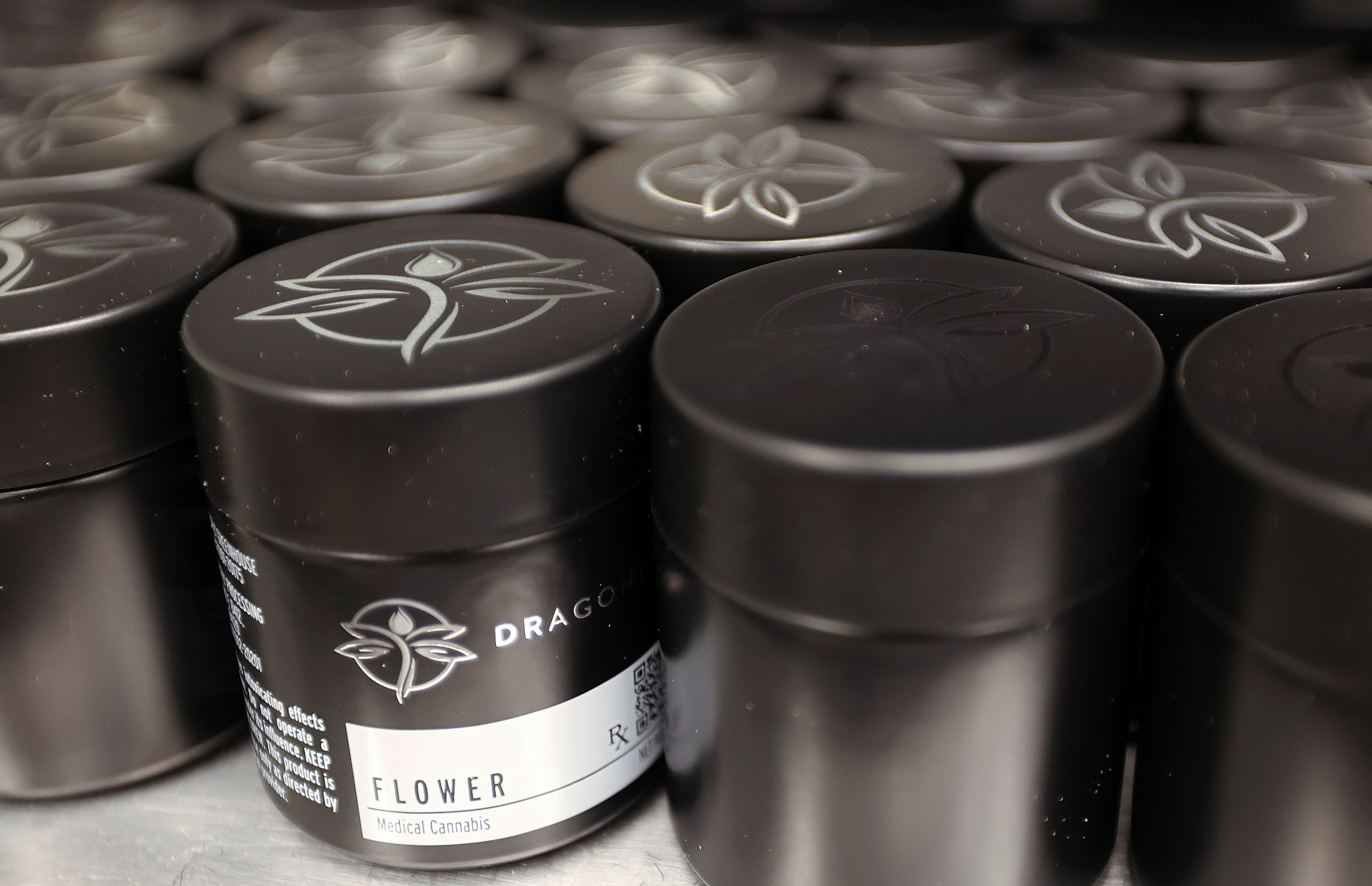 Jars of medical cannabis flowers are pictured at the Dragonfly processing plant in South Salt Lake on March 24.