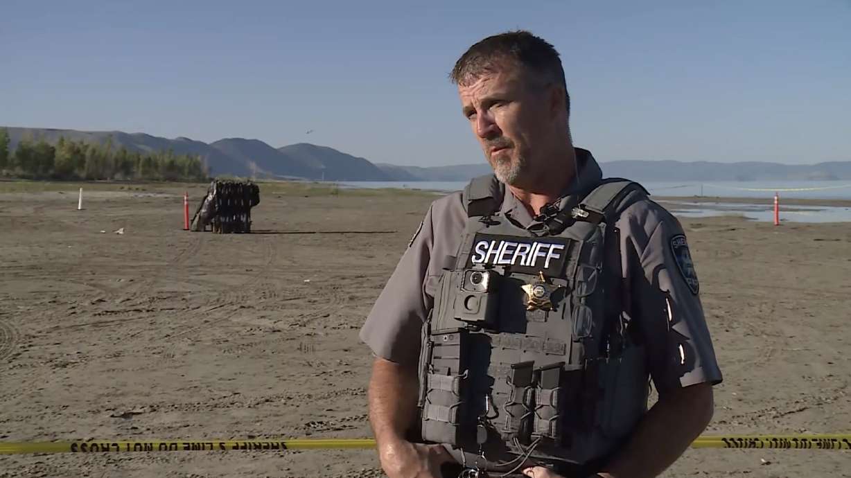 Bear County Sheriff Bart Heslington speaks at a Bear Lake beach in St. Charles, Idaho, Friday morning. He provided an update to the discovery of human remains there.