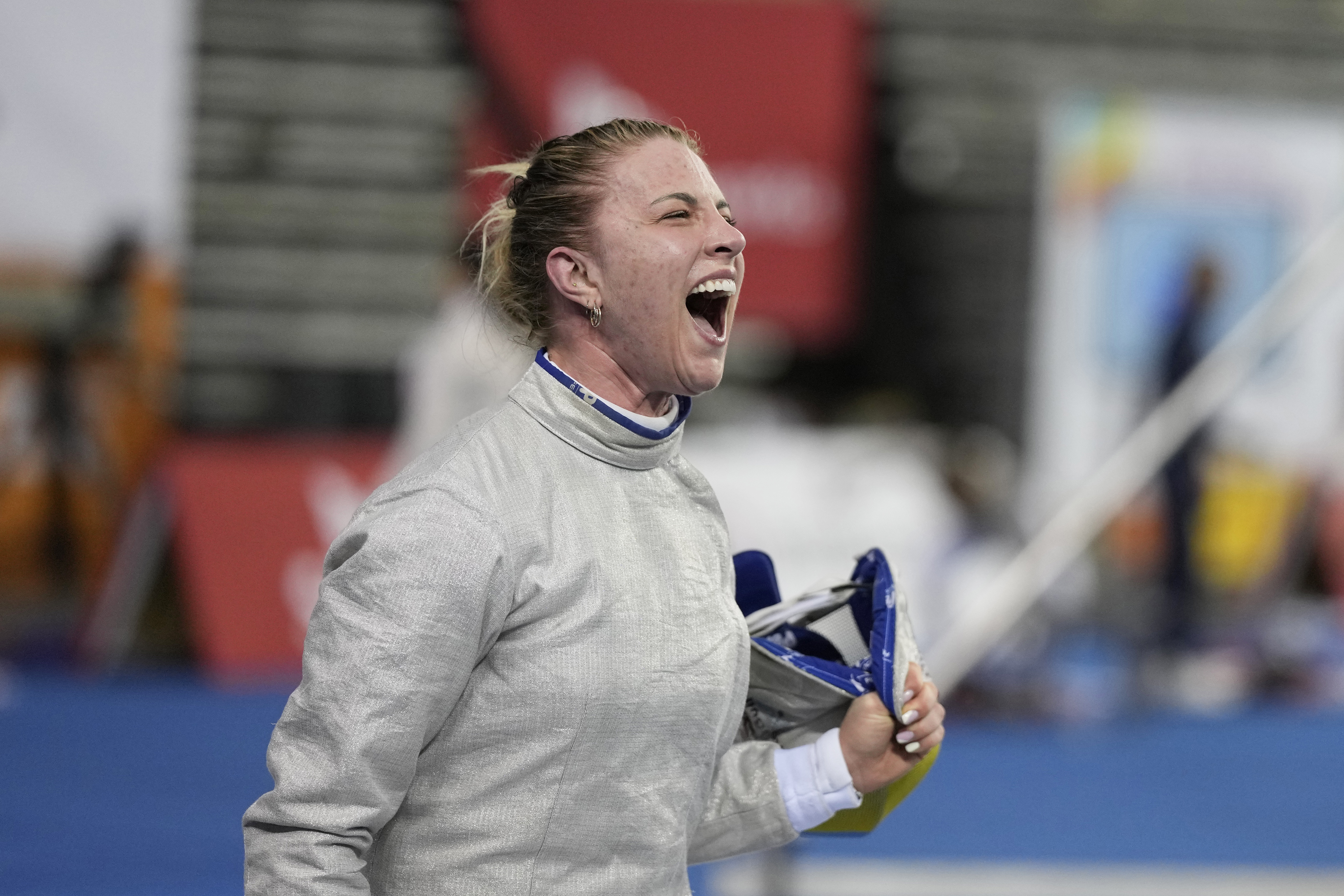 FILE - Olga Kharlan of Ukraine reacts after defeating Cyrielle Rioux of France during the women's FIE fencing sabre grand prix competition in Seoul, South Korea, Saturday, April 29, 2023. Ukraine has signaled it will no longer bar its athletes from competing against Russians who are taking part in sporting events as “neutral athletes." That would be a significant easing of its boycott policy a year before the Paris Olympics. 