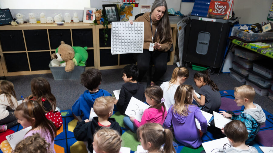 Students listen to kindergarten teacher Stephanie Cobabe at East Sandy Elementary School in Sandy on Feb. 27. The Utah State Board of Education said a website claiming to let families “pre-apply” for those newly passed school vouchers is confusing people into thinking they’re getting pre-qualified.