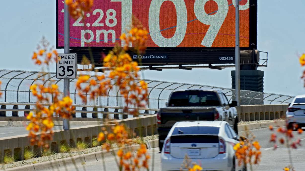A digital billboard displays an unofficial temperature, July 17 in downtown Phoenix. A historic heat wave that turned the Southwest into a blast furnace throughout July is beginning to abate with the late arrival of the monsoon rains.