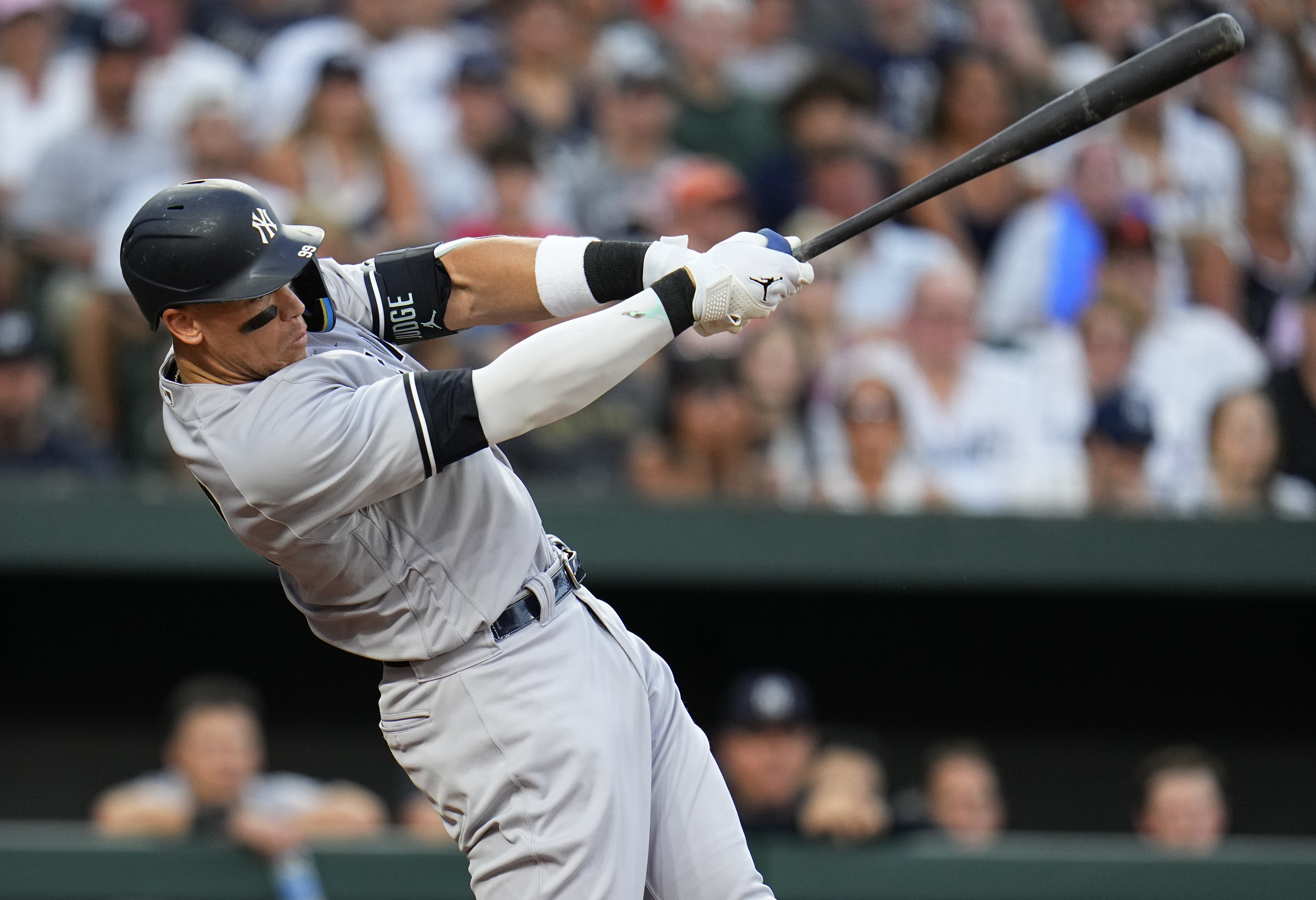 New York Yankees' Aaron Judge follows through on a swing as he hits a two-run home run off Baltimore Orioles starting pitcher Tyler Wells during the third inning of a baseball game, Saturday, July 29, 2023, in Baltimore. Yankees' Kyle Higashioka also scored on the home run. 