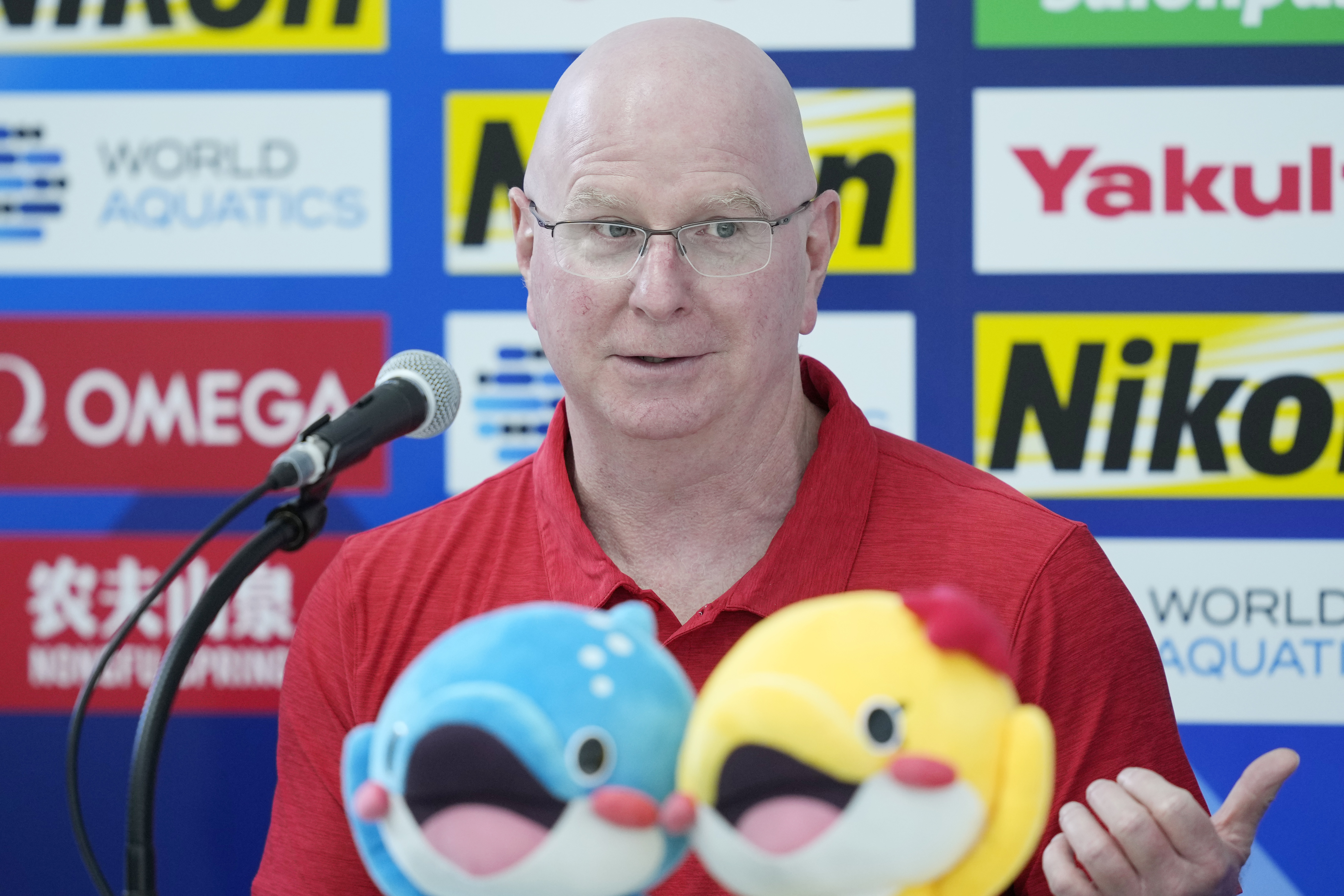 FILE - U.S. head coach Bob Bowman speaks during a news conference at the World Swimming Championships in Fukuoka, Japan, Friday, July 21, 2023. Legendary swimming coach Bowman keeps turning out winners. He is best known for helping American Michael Phelps to 23 Olympic gold medals. He's the swim coach at Arizona State University, and he's also coaching the American team at this year's world championships in Japan. 