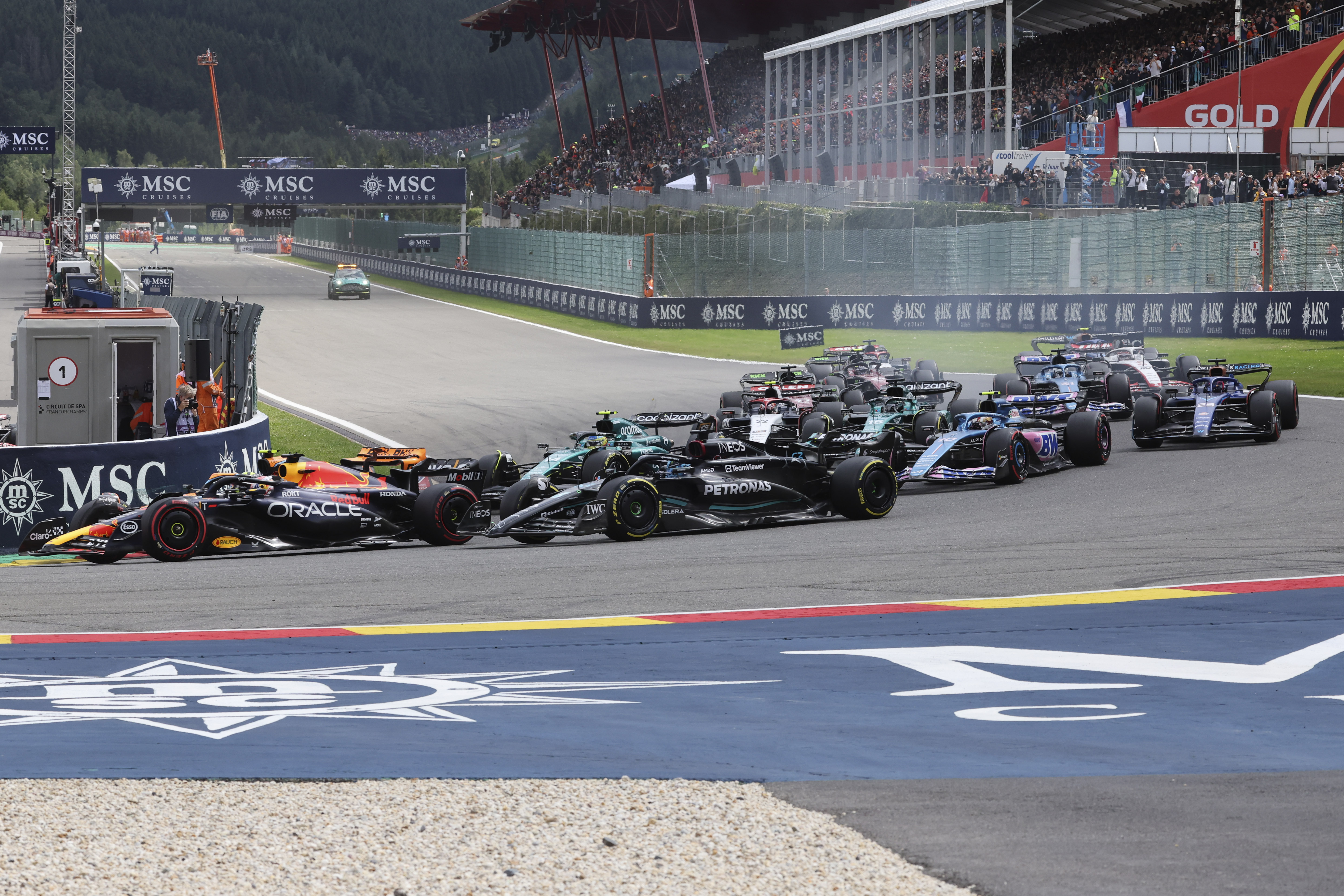 Red Bull driver Max Verstappen of the Netherlands, left, steers his car during the Formula One Grand Prix at the Spa-Francorchamps racetrack in Spa, Belgium, Sunday, July 30, 2023.