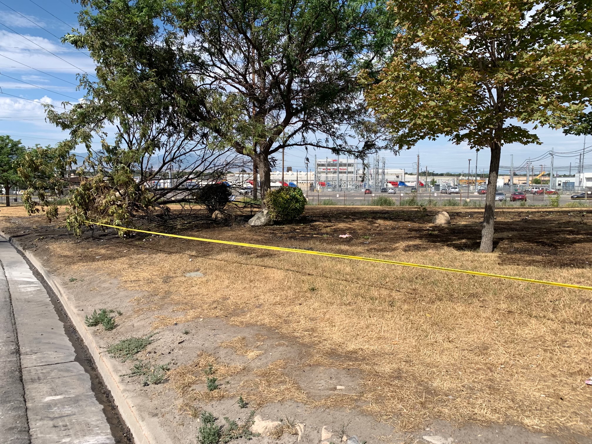 Scorched ground near 965 N. Beck Street in Salt Lake City shows where three people died in a fiery crash late Saturday.