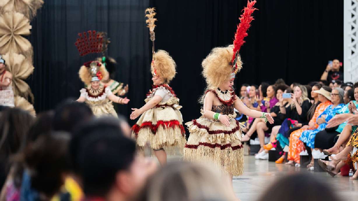 Models wear designs from Le Taupou Manaia at the first Utah Pacific Fashion Show at the Utah State Fair Park on Saturday.