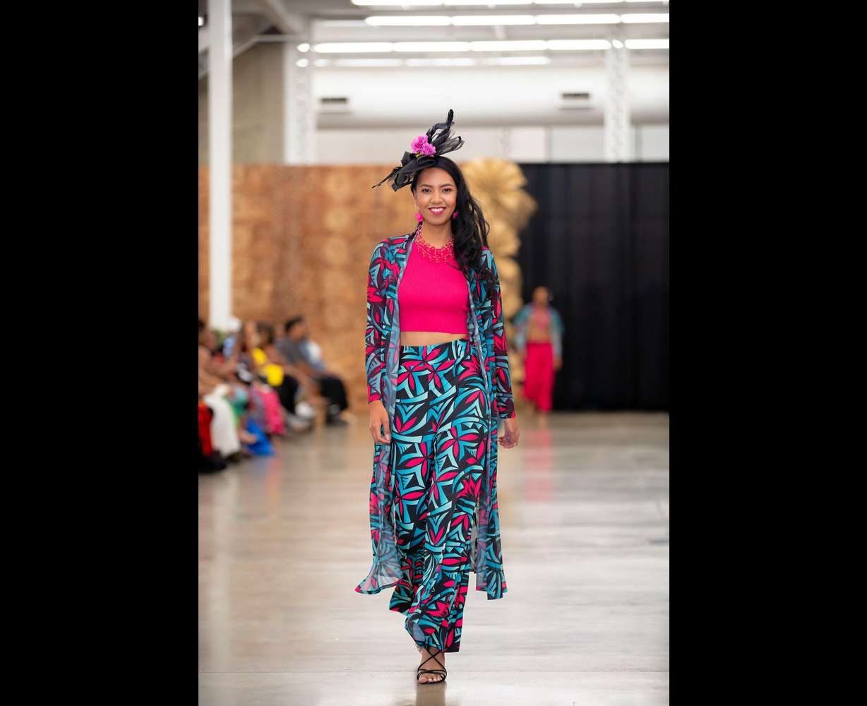 A model walks down the runway at the first Utah Pacific Fashion Show at the Utah State Fair Park on Saturday.