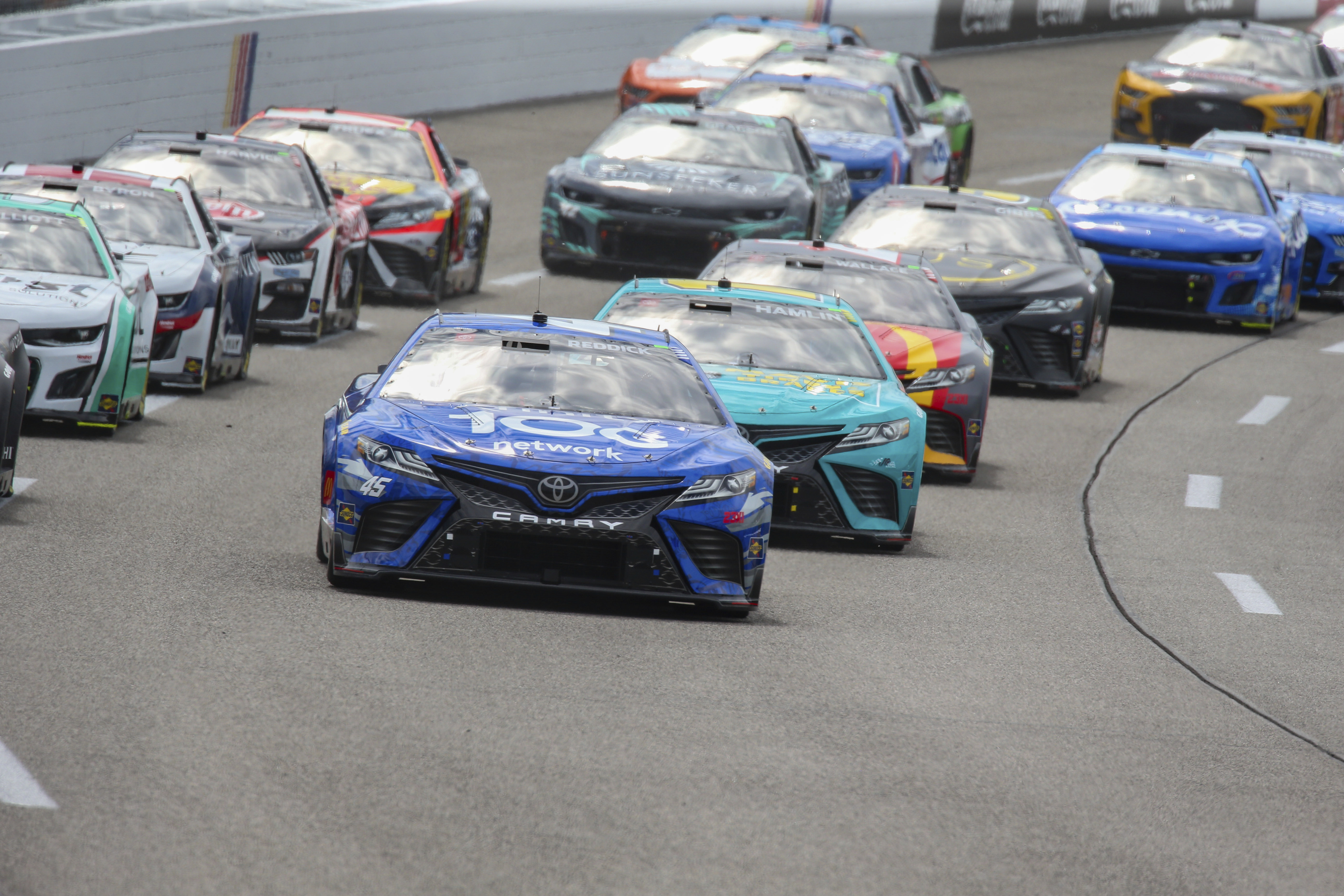 Tyler Reddick leads the field into Turn 1 at the start of a NASCAR Cup Series auto race Sunday, July 30, 2023, in Richmond, Va. 