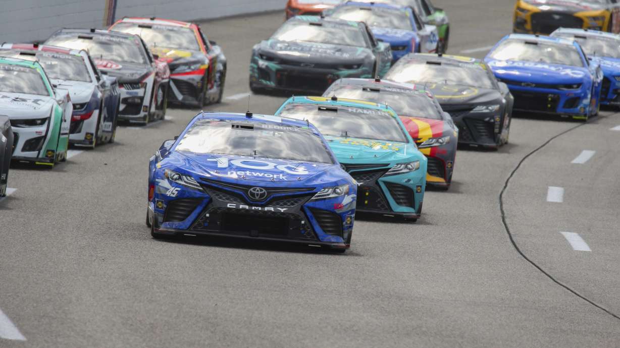 Tyler Reddick leads the field into Turn 1 at the start of a NASCAR Cup Series auto race Sunday, July 30, 2023, in Richmond, Va.