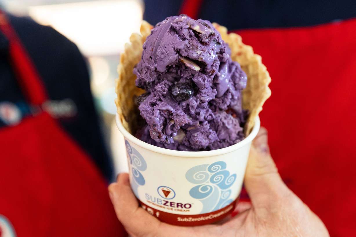 Jerry Hancock holds a cup of ice cream at Sub Zero in Provo on July 10. Each ice cream is hand-prepared using the liquid nitrogen freezing process.