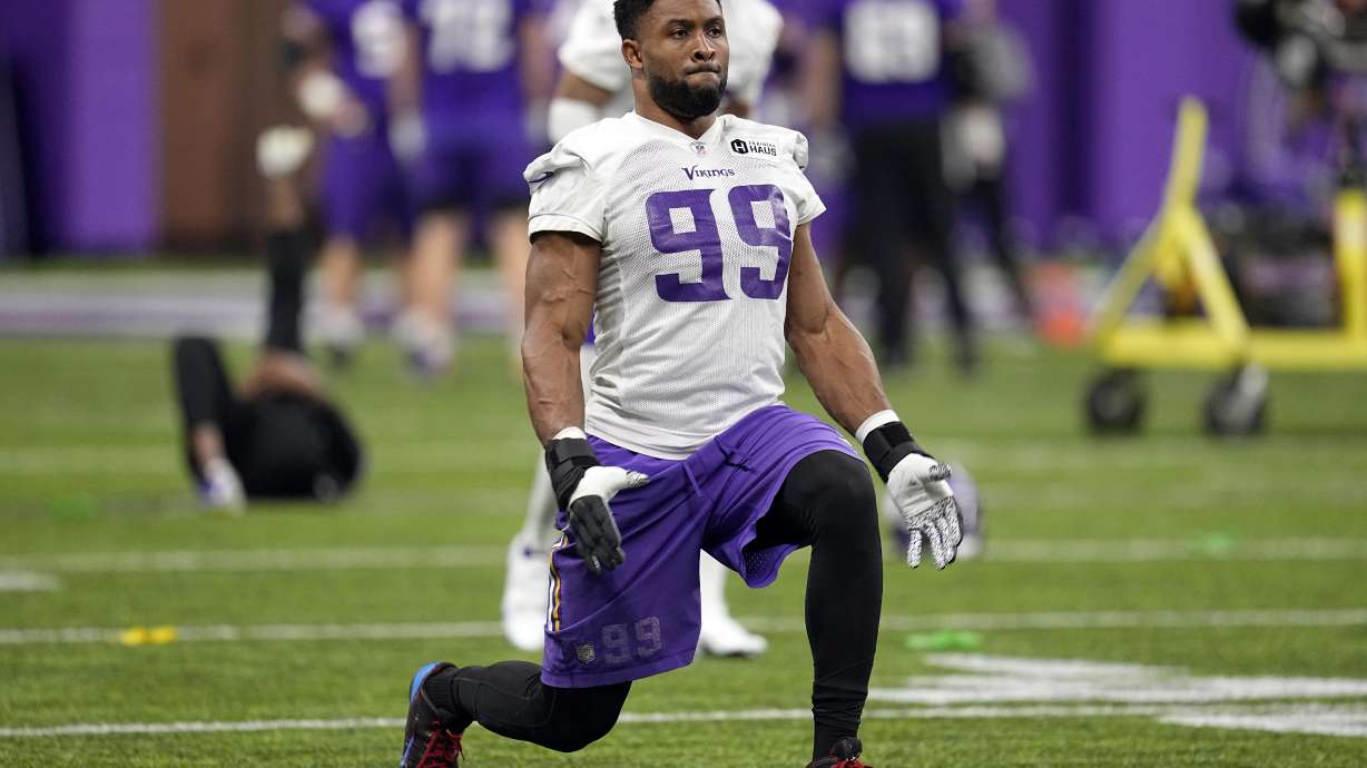 FILE - Minnesota Vikings linebacker Danielle Hunter (99) takes part in drills during an NFL football team practice in Eagan, Minn., Wednesday, Jan. 11, 2023. Hunter reported to training camp Tuesday, July 25, 2023, after skipping the offseason program, but his status with the club remains uncertain with his contract still an issue