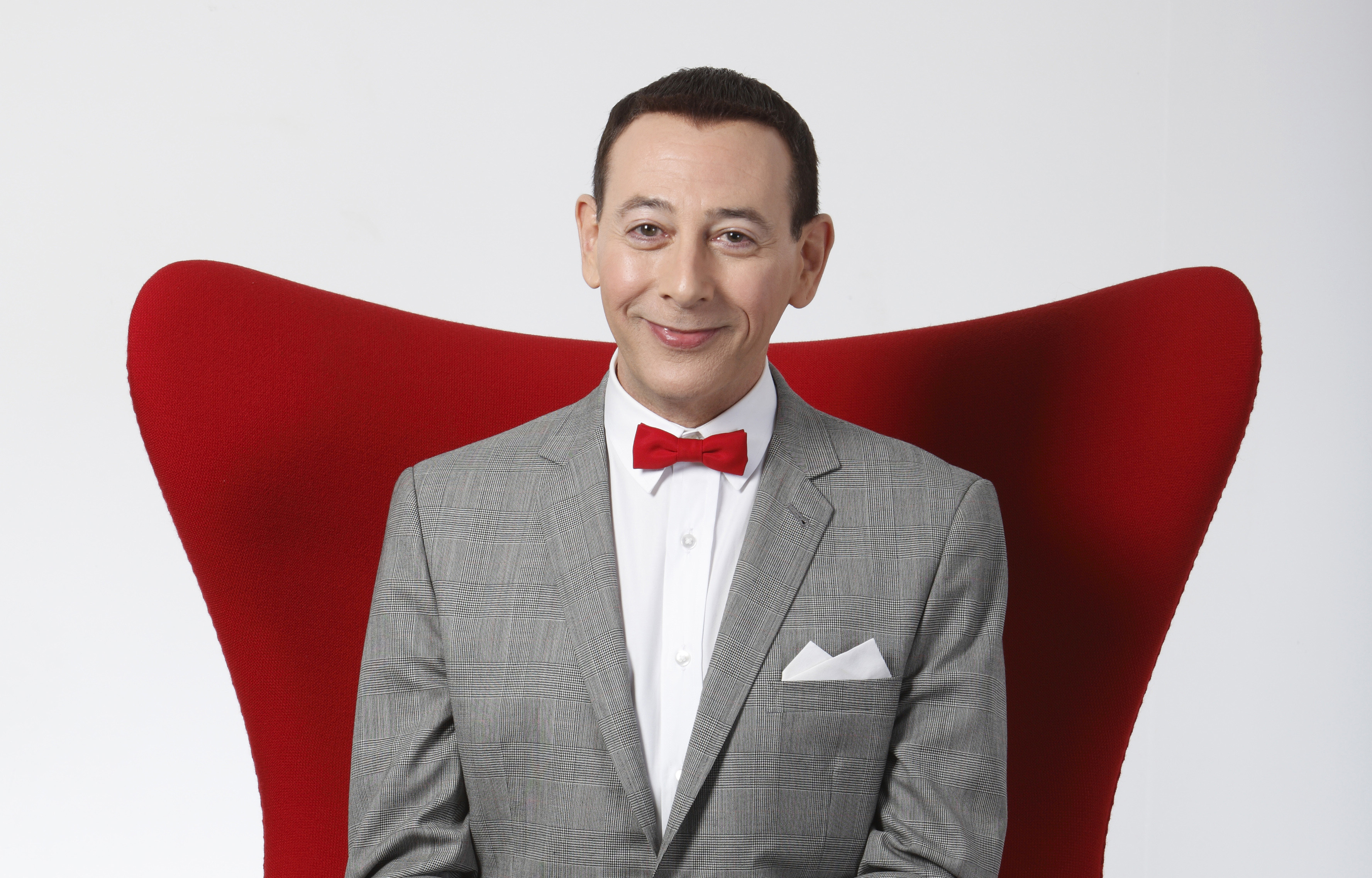 Actor Paul Reubens portraying Pee-wee Herman poses for a portrait while promoting "The Pee-wee Herman Show" live stage play, Dec. 7, 2009, in Los Angeles. Reubens died Sunday night after a six-year struggle with cancer that he did not make public, his publicist said in a statement. 