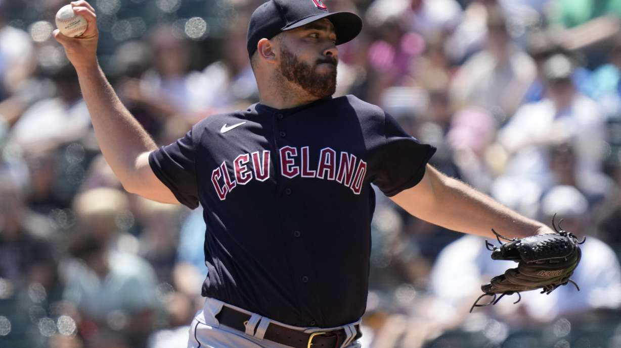 Cleveland Guardians starting pitcher Aaron Civale throws against the Chicago White Sox during the first inning of a baseball game in Chicago, Sunday, July 30, 2023.