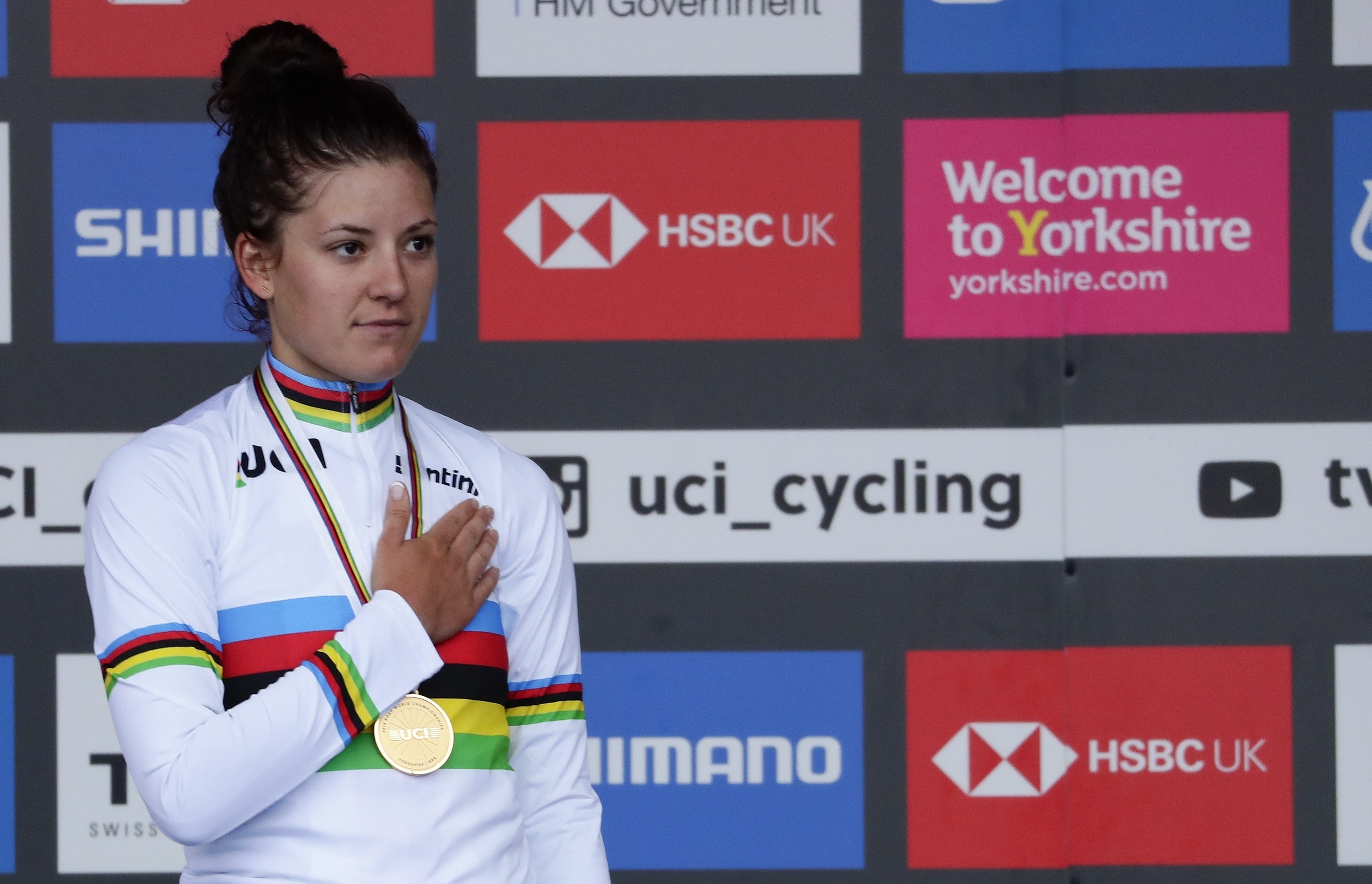 FILE - United States' Chloe Dygert listens to the national anthem on the podium after winning the women's elite individual time trial event at the road cycling World Championships in Harrogate, England, Tuesday, Sept. 24, 2019. 