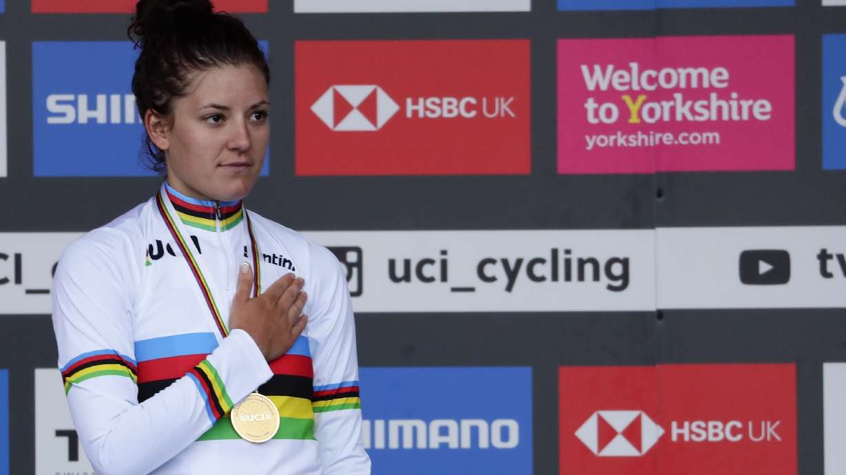 FILE - United States' Chloe Dygert listens to the national anthem on the podium after winning the women's elite individual time trial event at the road cycling World Championships in Harrogate, England, Tuesday, Sept. 24, 2019.