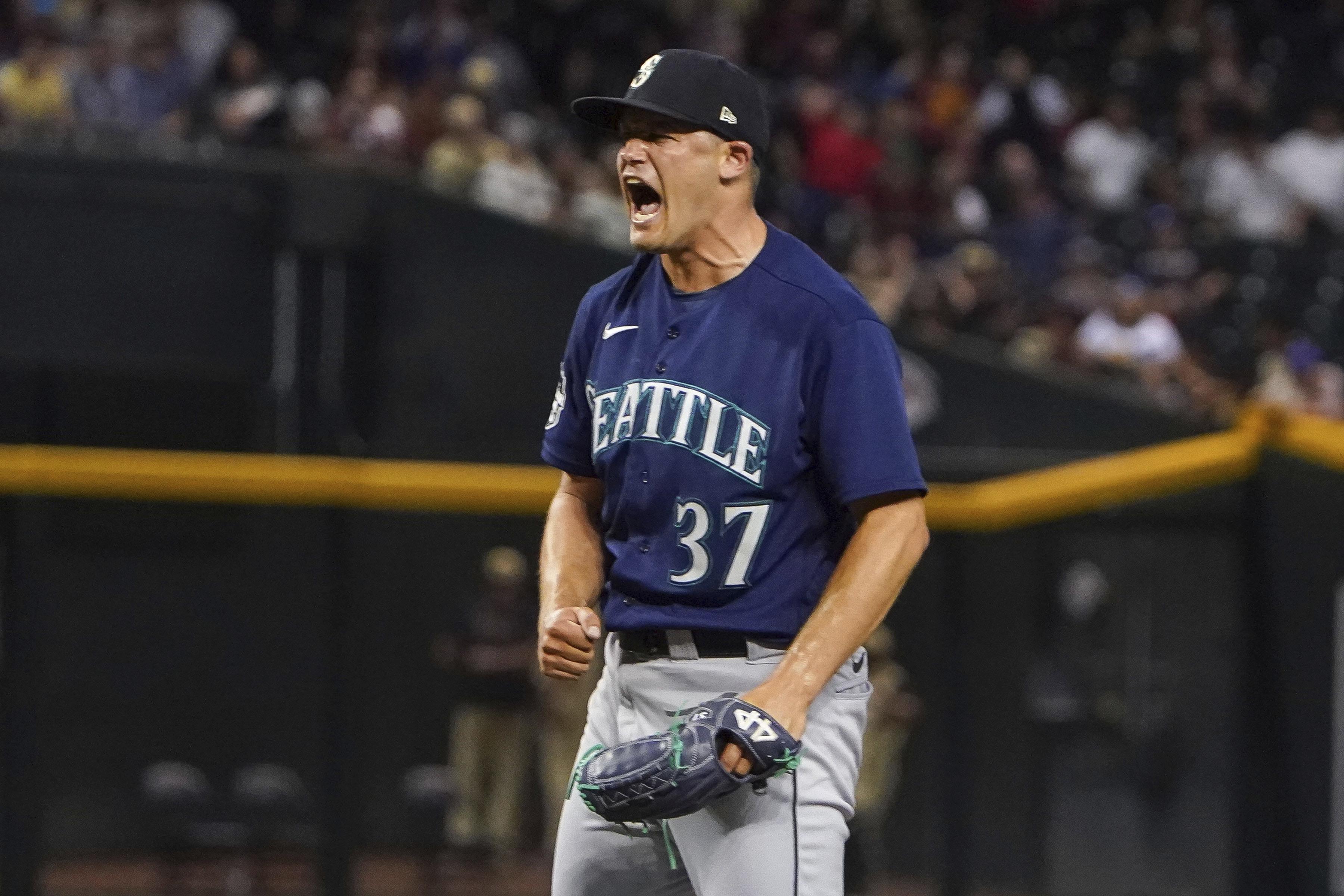 Seattle Mariners pitcher Paul Sewald celebrates striking out Arizona Diamondbacks' Christian Walker for the final out of a baseball game Friday, July 28, 2023, in Phoenix. The Mariners won 5-2.