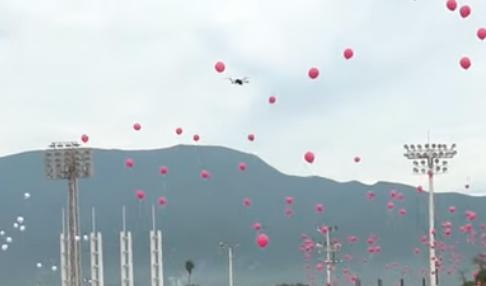 A drone flies amid a balloon launch in Mexico, but the drone doesn't seem to capture much as it spirals to the ground.