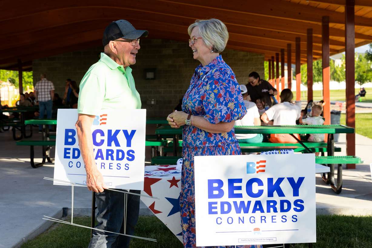 Becky Edwards talks to Kendall Thomas at an informal meet-and-greet at Porter Way Park in Stansbury Park on July 20. Edwards is one of the candidates running for the congressional seat being vacated by Rep. Chris Stewart.