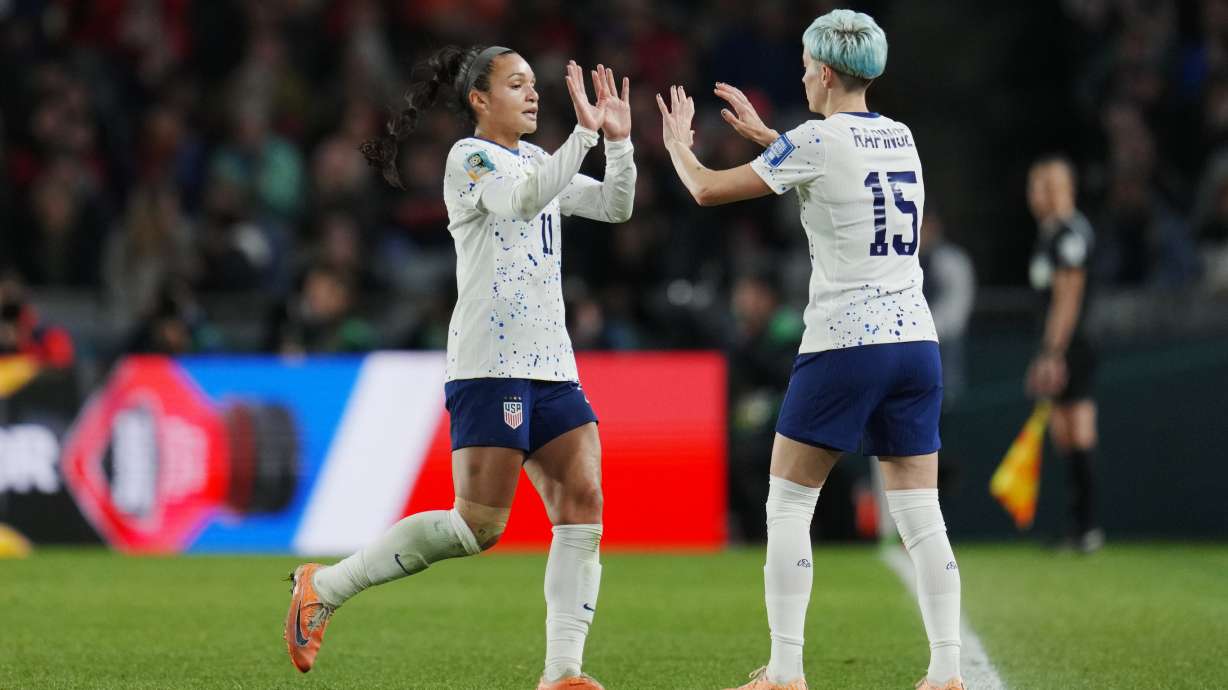 United States' Sophia Smith, left, is replaced by Megan Rapinoe during the second half of the FIFA Women's World Cup Group E soccer match between Portugal and the United States at Eden Park in Auckland, New Zealand, Tuesday, Aug. 1, 2023.