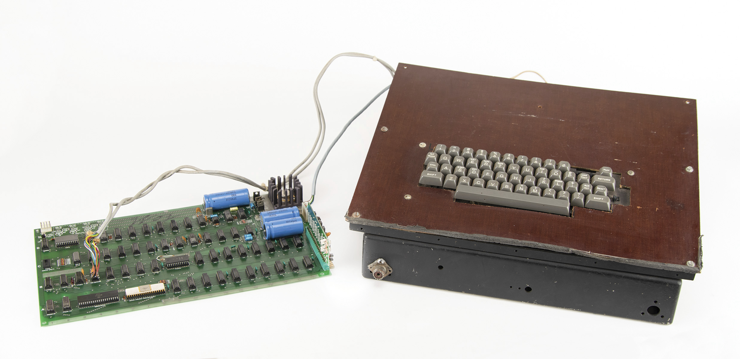 This photo shows a vintage Apple computer built in the 1970s and signed by company co-founder Steve Wozniak. The Apple-1 is being sold at auction in Boston.  