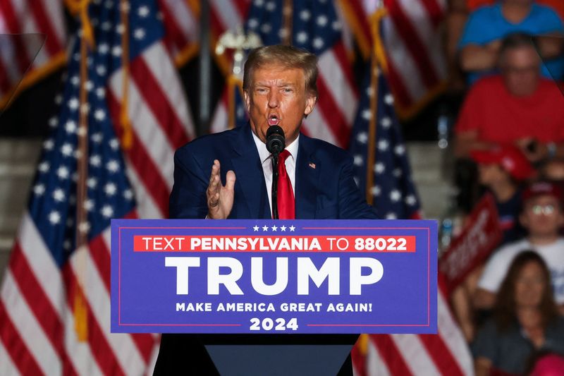 Former President Donald Trump speaks during a campaign rally in Erie, Penn., Saturday. Trump on Tuesday was hit with criminal charges for a third time in four months as he campaigns to regain the presidency.