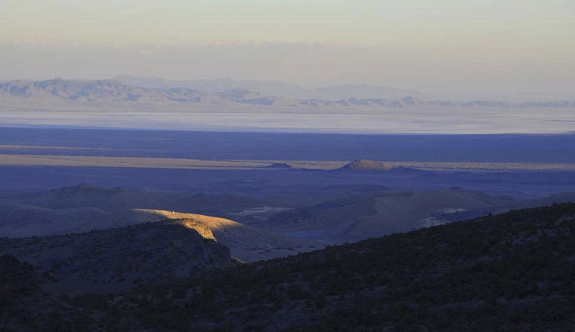 A ray of sunlight peeks through clouds above western Utah’s House Range just north of Sevier Lake in Millard County. Environmentalists filed a lawsuit on Monday to prevent the construction of a new potash mine that they say would devastate a lake ecosystem in the drought-stricken western Utah desert.